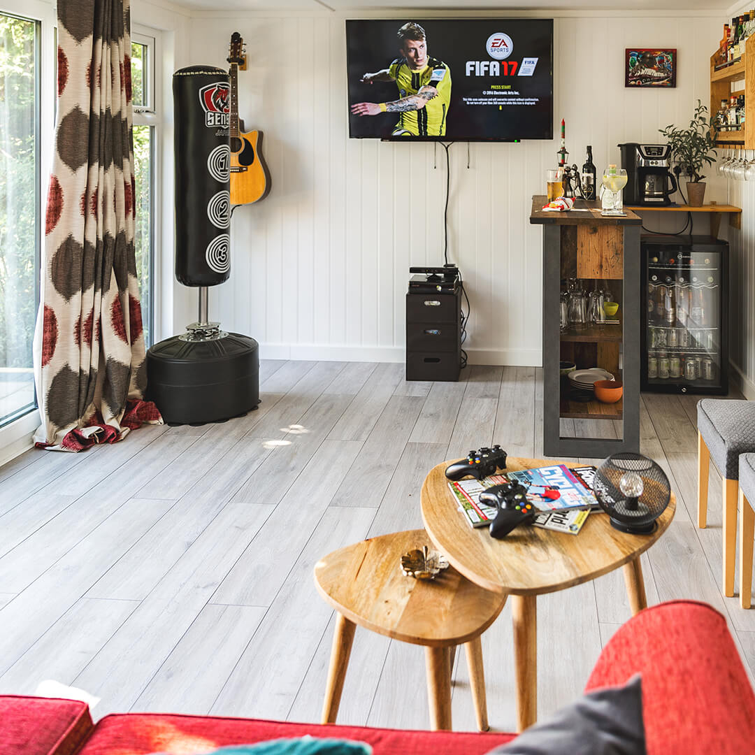 Garden Bar Room with living room filled with furniture and a flat screen TV