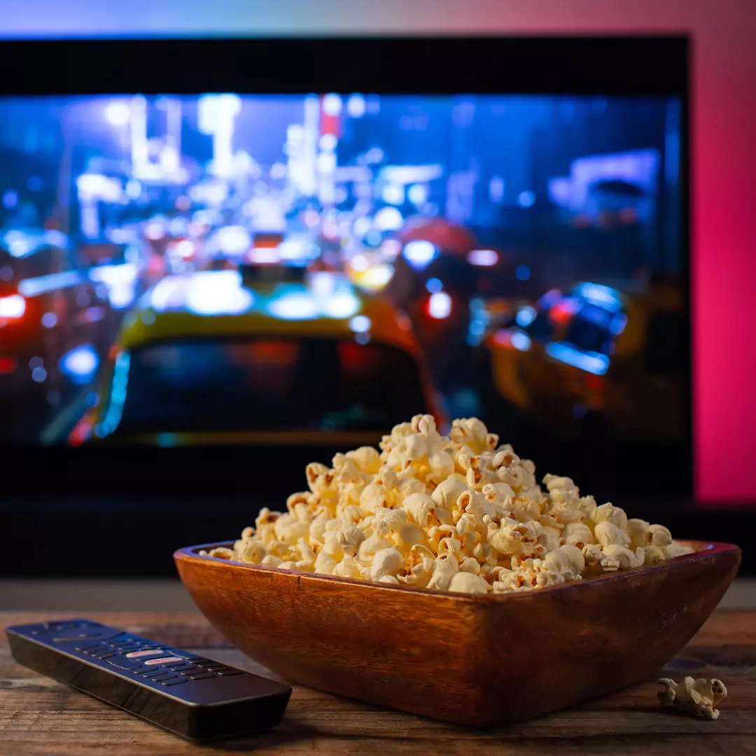 interior of a garden cinema room with bowl of popcorn in foreground