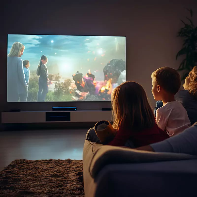 interior shot inside a home cinema room with family enjoying a movie together