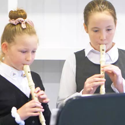 Langar C of E pupils practising music in their music cabin