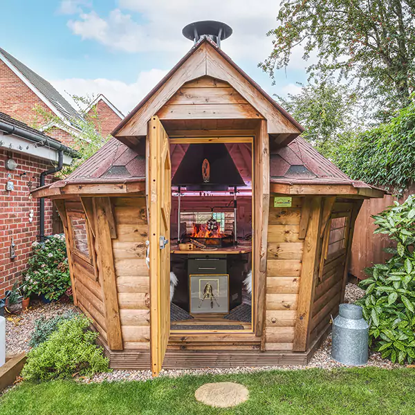 Small BBQ grill hut with red roof