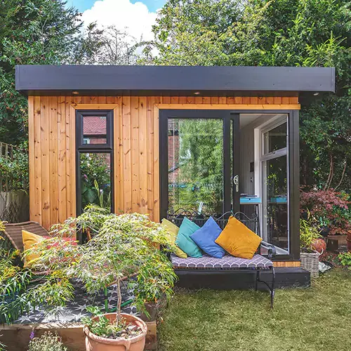 Outside a hybrid-clad garden room with redwood at front