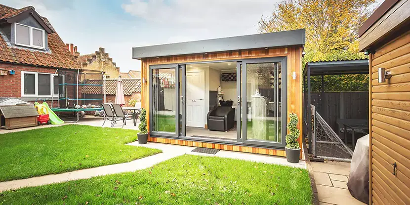 small garden office in corner of garden 