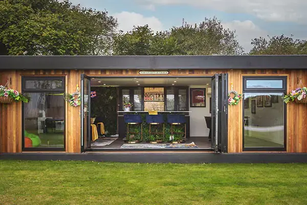 Large garden man cave with bifold doors