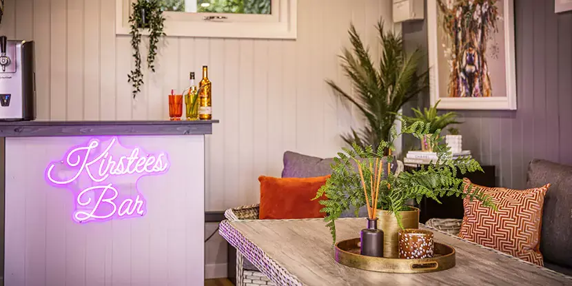 interior of a garden bar with neon sign 