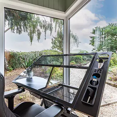 Interior of a small garden office with architect's easel