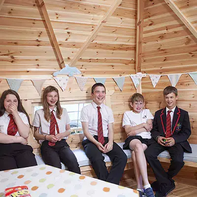 School children enjoying their timber school cabin