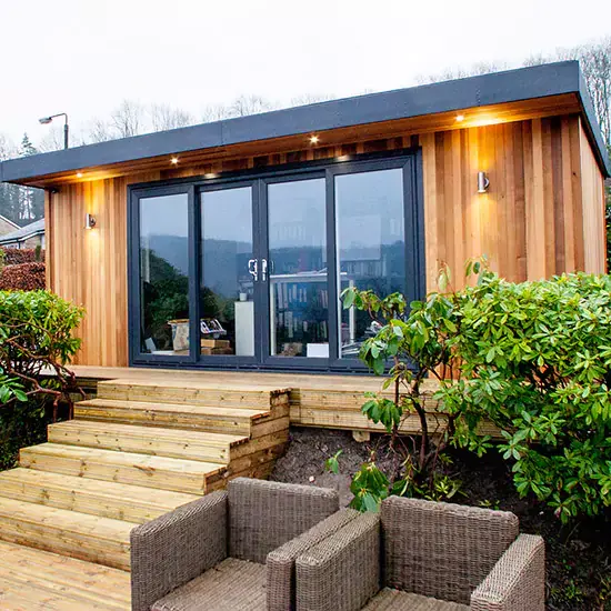 Internal shot of a garden photo studio cabin with backdrops, lighting and props